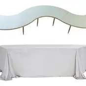 Serpentine S-curve: gold base with black glass tops dressed in colored velvet covers; floor-length tablecloth shown on one module.